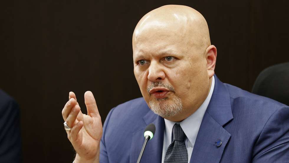 epa10676678 The prosecutor of the International Criminal Court (ICC), Karim Khan, meets with the president of the JEP, magistrate Roberto Vidal (out of frame), at the headquarters of the Special Jurisdiction for Peace (JEP) in Bogota, Colombia, 06 June 2023. Khan, who is visiting Colombia for the second time, recognized the Latin American country as an example of the Transitional Justice model. Khan's visit began this Monday with a meeting that he held with President Gustavo Petro and his agenda will continue this Wednesday with his participation in the panel "Roadmap to justice in Colombia" organized by the Foreign Ministry.  EPA/Mauricio Duenas Castaneda