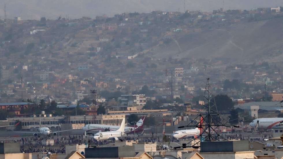 epa09416577 A view of Hamid Karzai International Airport after Taliban took control of Kabul, Afghanistan, 16 August 2021. Several people were reportedly killed at Kabul airport on 16 August as Afghans were attempting to hang on a moving US military plane leaving the airport. Taliban co-founder Abdul Ghani Baradar earlier in the day declared victory and an end to the decades-long war in Afghanistan, a day after the insurgents entered Kabul to take control of the country. Baradar, who heads the Taliban political office in Qatar, released a short video message after President Ashraf Ghani fled and conceded that the insurgents had won the 20-year war.  EPA/STRINGER