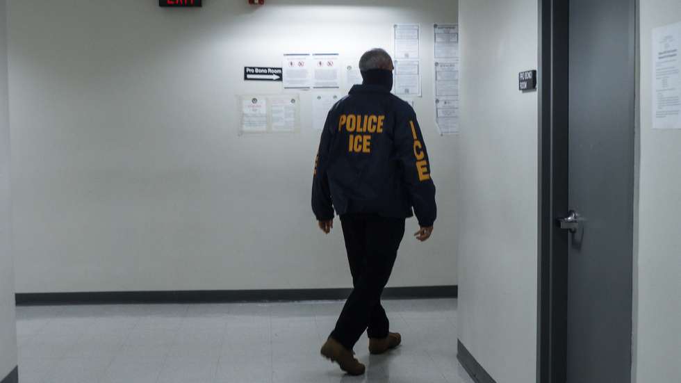 epa12601299 An Immigration and Customs Enforcement agents walks down the hallway outside federal immigration court in New York, New York, USA, 18 December 2025. The Trump administration has expanded the number of third countries willing to accept asylum seekers and deportees from the United States and adopted a measure that allows for dismissal of asylum applications without individual hearings.  EPA/OLGA FEDOROVA