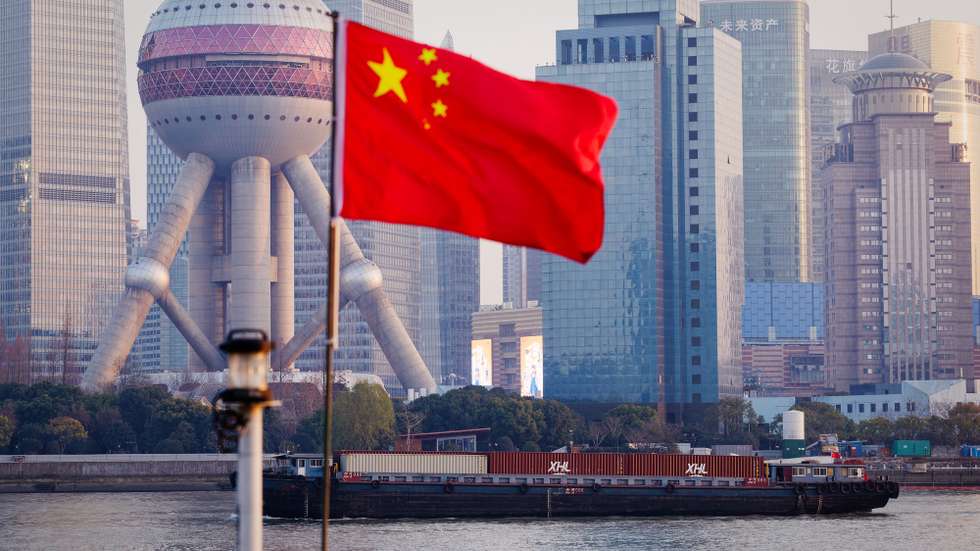 epa12647824 Cargo ships sail on Huangpu River, in Shanghai, China, 13 January 2026 (issued 14 January 2026). According to the General Administration of Customs, China’s trade surplus reached a record $1 trillion in the first 11 months of the year, with exports rising 5.4 percent and imports falling 0.6 percent; the November surplus stood at $112 billion, the third largest on record.  EPA/ALEX PLAVEVSKI