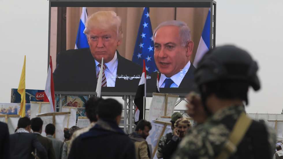 epa13117707 A digital billboard features (L-R) US President Donald Trump and Israeli Prime Minister Benjamin Netanyahu, as Houthi supporters stage a protest against Saudi Arabia, in Sana'a, Yemen, 17 July 2026. Thousands of Houthi supporters demonstrated in Sana'a against Saudi Arabia a day after Houthi leader Abdul-Malik al-Houthi threatened to target Saudi oil facilities if Riyadh escalated its military involvement in Yemen. Saudi Arabia has supported the Yemeni government militarily and politically since 2015, after Houthi forces seized much of northern Yemen.  EPA/YAHYA ARHAB