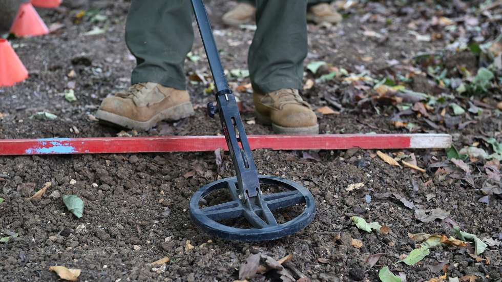epa05653964 Lebanese's bomb expert of the Norwegian People's Aid (NPA) searches for unexploded cluster bombs, in the southern Lebanese city of Tyre, Lebanon, 30 November 2016. NPA is a non-governmental organization that specializes in clearing unexploded bombs, cluster munitions, landmines and other abandoned ordnance in Lebanon. Lebanon is a country that has been severely impacted by cluster bombs over the course of several wars. More than 50 people have been killed and 350 injured by cluster bomb explosions in southern Lebanon since the Israeli invasion of 2006.  EPA/WAEL HAMZEH