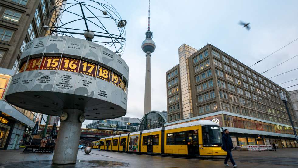 epaselect epa08886866 A tram passes the Alexanderplatz during the morning rush hour in Berlin, Germany, 16 December 2020. As the number of cases of the COVID-19 disease caused by the SARS-CoV-2 coronavirus is still rising throughout Germany, the government has imposed a second hard lockdown with businesses closing from 16 December on until 10 January 2021.  EPA/ALEXANDER BECHER