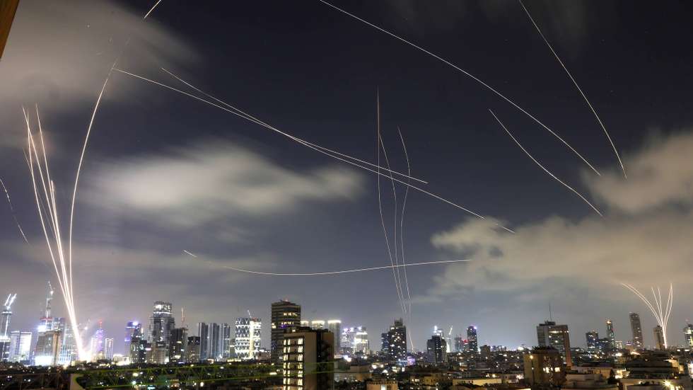 epa12182449 The Iron Dome, the Israeli air defense system, intercepts missiles fired from Iran, over Tel Aviv, Israel, 17 June 2025. Israel and Iran have been exchanging fire since Israel attacked Iran on 13 June 2025 as part of operation 'Rising Lion'.  EPA/ABIR SULTAN