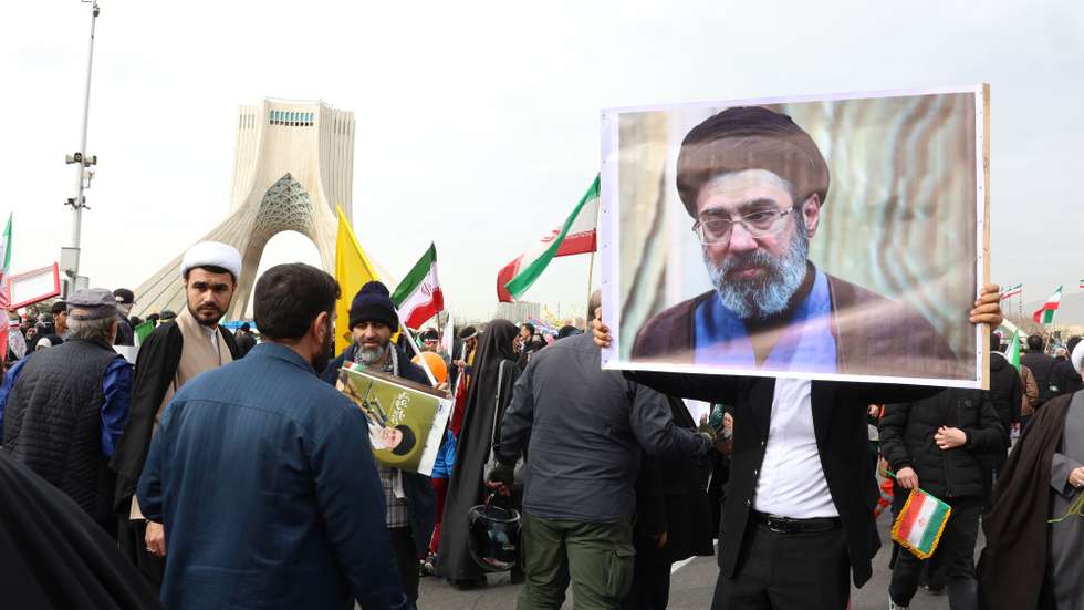epa12805483 An Iranian man holds a portrait of Mojtaba Khamenei, son of the late Supreme Leader Ayatollah Ali Khamenei, during the 47th anniversary celebrations of the Islamic Revolution in Tehran, Iran, 11 February 2026 (issued 09 March 2026). Iran's Assembly of Experts has appointed Mojtaba Khamenei to replace his father as the country's new supreme leader, according to state media.  EPA/ABEDIN TAHERKENAREH