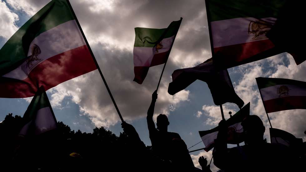 epaselect epa09336039 People attend a protest against the Iranian government during protest organized by 'National Council of Resistance of Iran' in Berlin, Germany, 10 July 2021. Protesters of the National Council of Resistance of Iran and the German-Iranian Society gathered in Berlin to demonstrate against Iranian regime and the alleged use of the death penalty in Iran.  EPA/FILIP SINGER