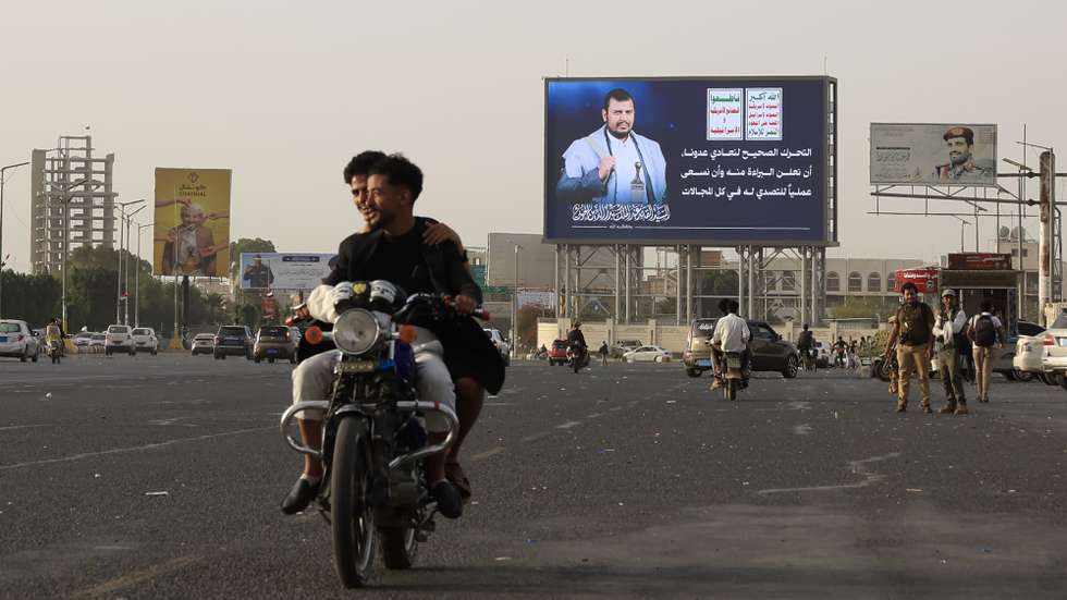 epaselect epa12958124 People ride a motorcycle past a digital billboard featuring Houthi leader Abdul-Malik al-Houthi in Sana'a, Yemen, 14 May 2026. Yemen's internationally recognized government and the Houthis have signed a UN-sponsored agreement to exchange more than 1,700 conflict-related detainees, marking the largest prisoner exchange since the outbreak of Yemen's war in 2014, according to a statement by the UN envoy to Yemen, Hans Grundberg.  EPA/YAHYA ARHAB