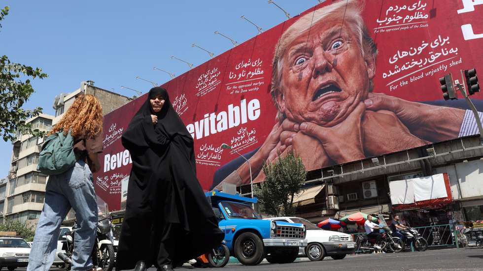 epa13178253 Iranians walk near an anti-Trump billboard in Tehran, Iran, 19 August 2026. Iranian parliament speaker Mohammad Bagher Ghalibaf said that the Strait of Hormuz will remain closed until the United States lifts its blockade and ends sanctions.  EPA/ABEDIN TAHERKENAREH RESTRICTIONS: NO Access Israel Media/Persian Language TV Stations Outside Iran/Strictly No Access BBC Persian/VOA Persian/Manoto TV/Iran International TV. (As mandated by Iran's Directorate General for Foreign Media) --