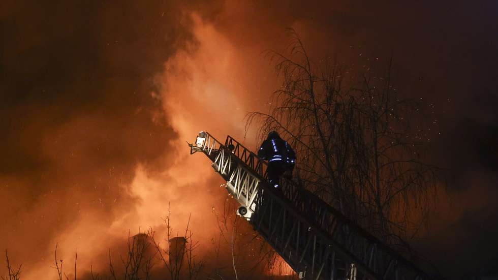 epa10955623 Emergency personnel work at the site of a drone strike in Kharkiv, northeastern Ukraine, early 03 November 2023, amid the Russian invasion. The Kharkiv region police said at least 10 Russian drones hit Kharkiv and its suburbs, and as a result of the strikes, a residential building, a service station, and an administrative building were on fire. There were no immediate reports on casualties, police added. Russian forces launched a 'massive attack' on Ukraine overnight, with strikes reported in the regions of Kharkiv, Kherson, Donetsk, Odesa and Ivano-Frankivsk, Ukrainian Interior Minister Ihor Klymenko wrote on telegram.  EPA/SERGEY KOZLOV