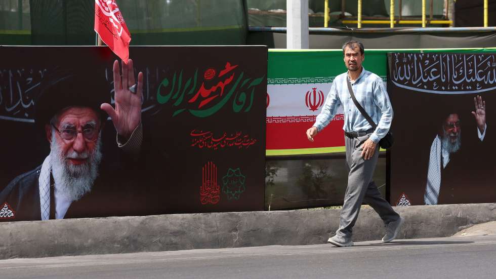 epa13129789 An Iranian man walks next to the pictures of late Iranian supreme leader Ayatollah Ali Khamenei on a street in Tehran, Iran, 24 July 2026.  Conflict between Iran and the US over the Strait of Hormuz continues, as US strikes have targeted several locations across Iran.  EPA/ABEDIN TAHERKENAREH RESTRICTIONS: NO Access Israel Media/Persian Language TV Stations Outside Iran/Strictly No Access BBC Persian/VOA Persian/Manoto TV/Iran International TV. (As mandated by Iran's Directorate General for Foreign Media) --