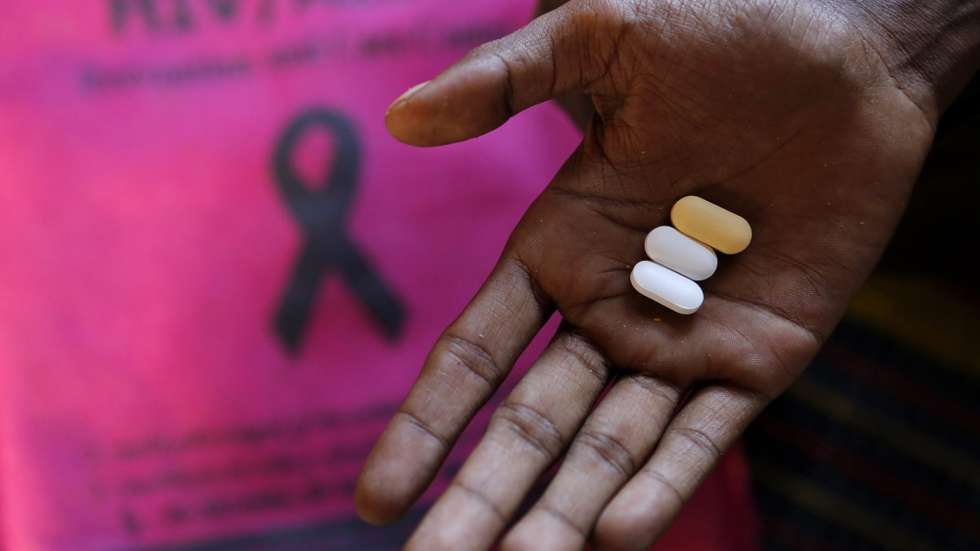 epa04510725 A man living with HIV prepares to take his medicine at the HIV/AIDS Care Center, a hospice run by Myanmar's opposition leader Aung San Suu Kyi's National League for Democracy (NLD) Party, in Yangon, Myanmar, 01 December 2014. World AIDS Day is marked worldwide annually on 01 December to raise awareness of those living with the virus, and this comes amids calls for the Government of Myanmar to do more to tackle the virus despite a small decline in the rate of infection, with the United Nations estimating 200'000 people in the country live with the virus, prompting the Government to pledged a further $5 million to tackle the issue October.  EPA/LYNN BO BO