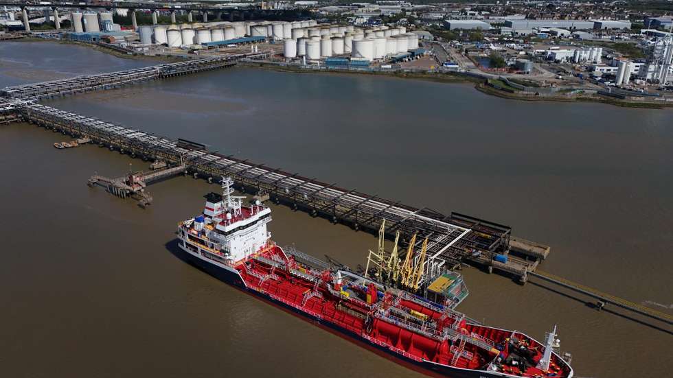 epa12889041 An image made with a drone shows the Maltese registered Flyoz chemical and oil oil tankers delivering to gas and fuel storage units at the Navigator Terminal in Grays, Britain, 14 April 2026. Oil prices have risen above 100 US dollars a barrel again as the US Navy begins a blockade of the Strait of Hormuz following the collapse of ceasefire negotiations between Iran and the United States. Meanwhile, leasing of electric vehicles has surged across Europe amid rising petrol prices linked to the Iran war.  EPA/NEIL HALL
