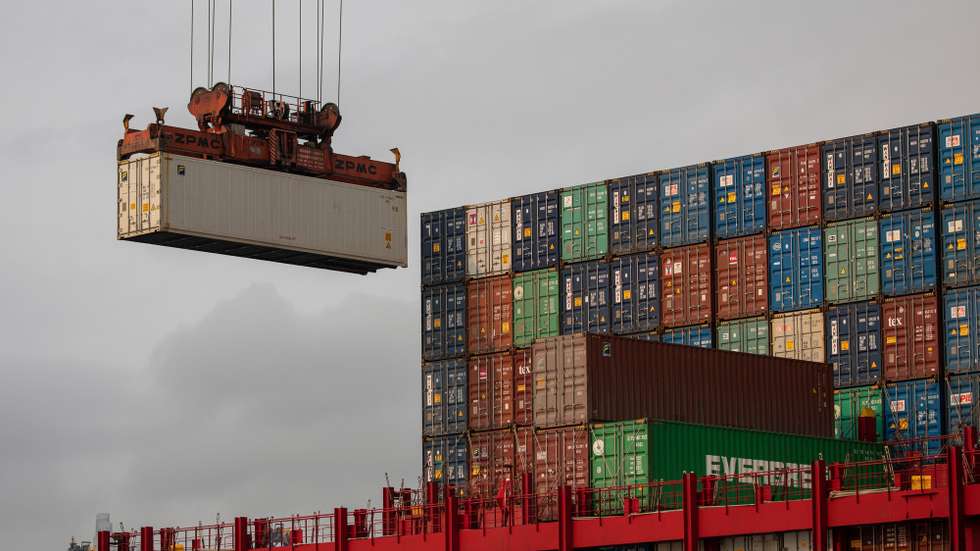 epa09104583 A ship is loaded with containers in the Kwai Tsing Terminals in Hong Kong, China, 29 March 2021. The fourth quarter 2020 total port cargo throughput decreased by 9.5 percent compared with the fourth quarter of 2019 to 61.3 million tonnes according to Hong Kong's Census and Statistics Department.  EPA/JEROME FAVRE