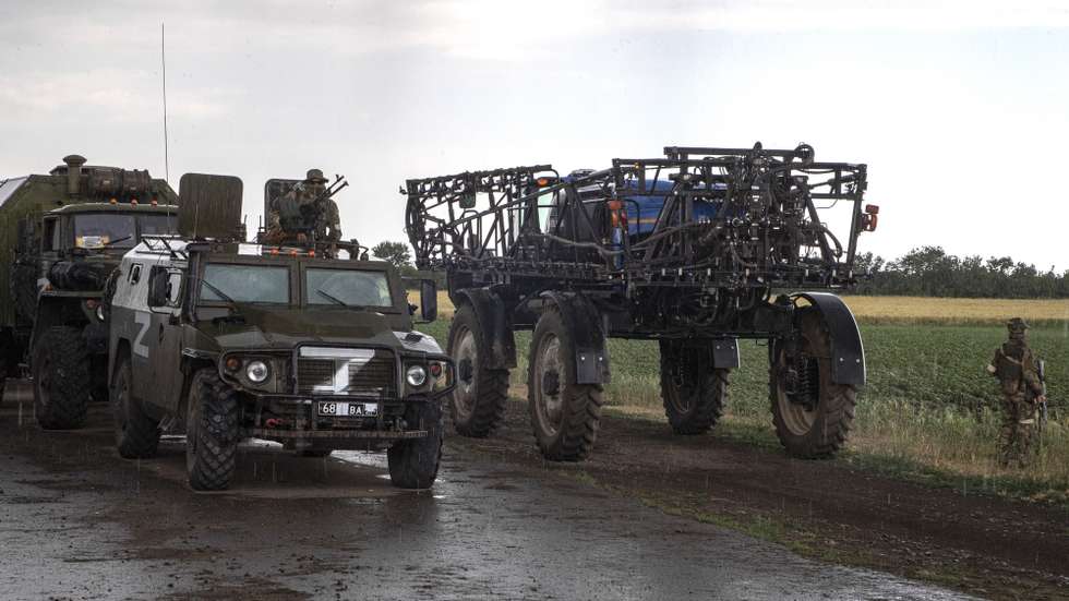 epa10013938 Russian servicemen and their vehicles seen near an agricultural tractor in front of a wheat field near Melitopol, Zaporizhia region, Ukraine, 14 June 2022 (Issued on 15 June 2022). The conflict in Ukraine has affected the availability and price of wheat worldwide. The Food and Agriculture Organization (FAO) of the United Nations said in its 10 June note assessing the risks emanating from the conflict in Ukraine that 'the current war raises concerns over whether crops will be harvested. It has already led to the closures of ports and oilseed crushing operations, affecting products intended for the export markets'. These are taking a toll on the country's exports of grains and vegetable oils. The city of Melitopol is located on the territory controlled by the troops of the Russian Federation and the city is administered by the Military-Civilian Administration controlled by Russia. On 24 February 2022 Russian troops entered the Ukrainian territory in what the Russian president declared a 'Special Military Operation', starting an armed conflict that has provoked destruction and a humanitarian crisis.  EPA/SERGEI ILNITSKY