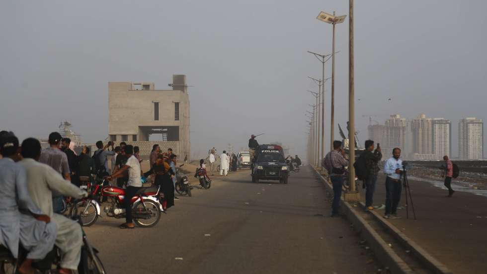 epa10687129 Police disperse visitors from the beach after authorities issued a warning for Cyclone Biparjoy, in Karachi, Pakistan, 12 June 2023. Cyclone Biparjoy, which is currently over the Arabian Sea, intensified on 11 June to an 'extremely severe' storm ahead of its expected arrival in India and Pakistan in the coming days. ThePakistan Meteorological Department (PMD) said that the country's southern coast would begin to feel the effects of the cyclone on 13 June afternoon or evening, noting that high-intensity winds may cause damage to loose and vulnerable structures.  EPA/REHAN KHAN