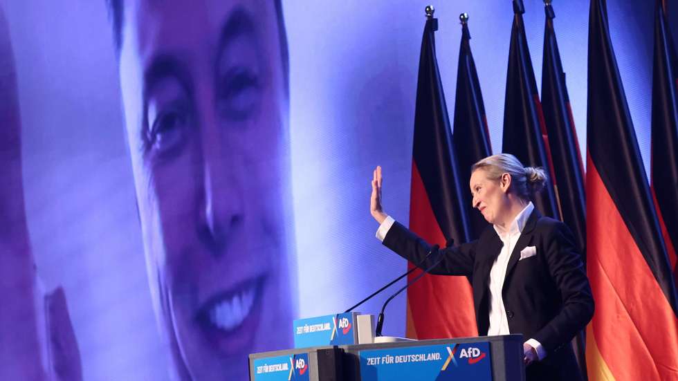epa11852370 Alternative for Germany (AfD) party and faction co-chairwoman and top candidate for the federal election Alice Weidel talks online to Elon Musk during her speech during election campaign launch in Halle, Germany, 25 January 2025. Germany will hold early federal elections on 23 February 2025.  EPA/HANNIBAL HANSCHKE