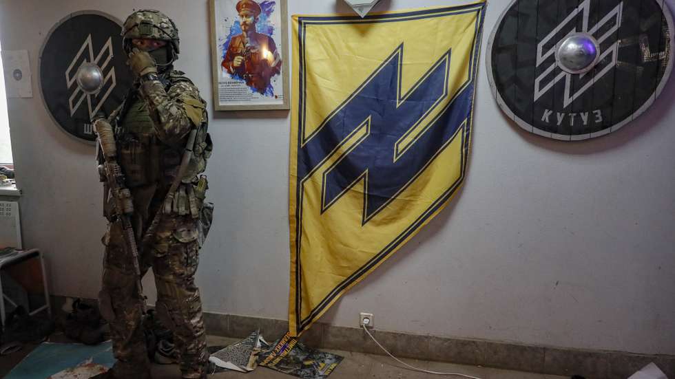 epa09956464 A picture taken during a visit to Mariupol organised by the Russian military shows Russian servicemen examine a base of the Azov Regiment in Yurivka village near Mariupol, Ukraine, 18 May 2022. On 24 February, Russian troops invaded Ukrainian territory starting a conflict that has provoked destruction and a humanitarian crisis. According to the UNHCR, more than six million refugees have fled Ukraine, and a further 7.7 million people have been displaced internally within Ukraine since.  EPA/SERGEI ILNITSKY