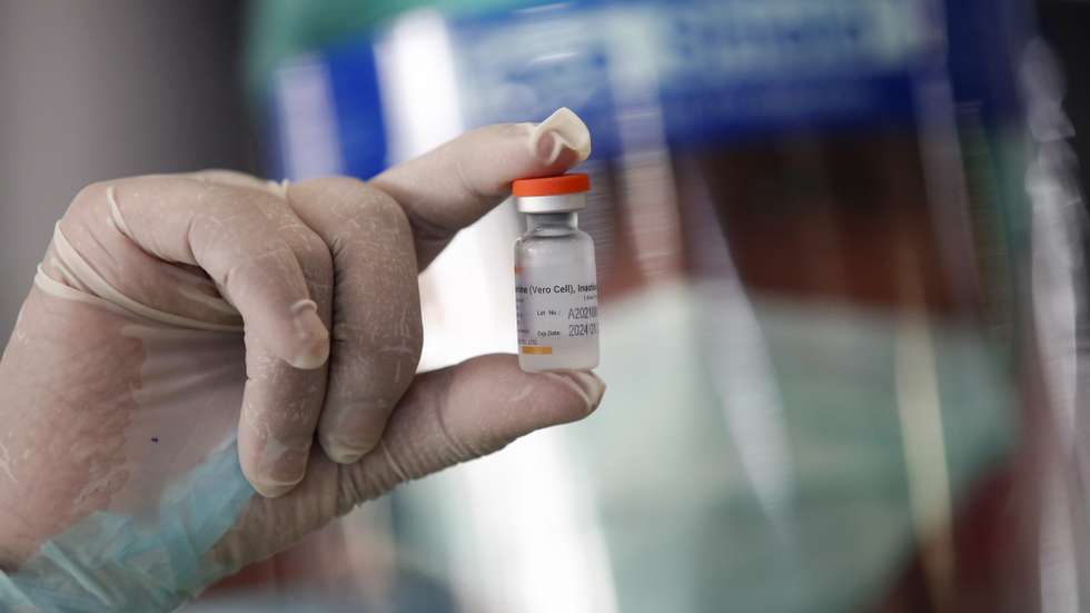 epa09079205 A Thai health worker displays a vial of CoronaVac vaccine against COVID-19, developed by China's Sinovac Biotech, during a mass vaccine inoculation as an effort to curb the spread of a COVID-19 pandemic cluster, at Bang Khae Market in Bangkok, Thailand, 17 March 2021. The Bangkok Metropolitan Administration starts its mass COVID-19 vaccine inoculation for 6,000 people in Bang Khae district to prevent the spread of disease after a new virus cluster was detected that spread hundreds of infections so far.  EPA/RUNGROJ YONGRIT