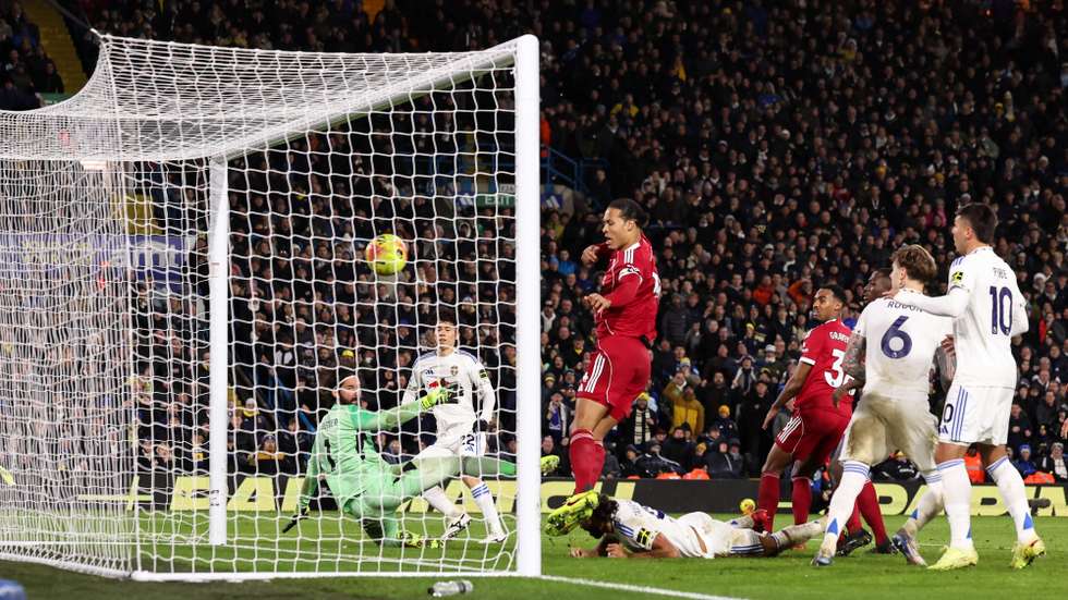 epa12575375 Ao Tanaka of Leeds (2-L) scores the 3-3 goal during the English Premier League match between Leeds United and Liverpool in Leeds, Great Britain, 06 December 2025.  EPA/ALEX DODD EDITORIAL USE ONLY. No use with unauthorized audio, video, data, fixture lists, club/league logos, 'live' services or NFTs. Online in-match use limited to 120 images, no video emulation. No use in betting, games or single club/league/player publications.