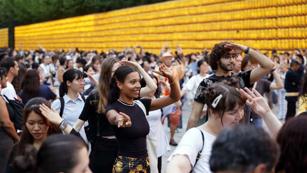 epa12241049 Tourists participate at a Bon Odori, traditional Japanese folk dance, at the Yasukuni Shrine during the annual Mitama Festival in Tokyo, Japan, 16 July 2025. According to data released by the Japan National Tourism Organization, the number of foreign visitors to Japan in June reached 3,377,800, a 7.6 percent increase from the same month last year, marking a record high for June. In the first half of 2025, total arrivals hit 21,518,100, exceeding the same period in 2024 by more than 3.7 million and surpassing the 20 million mark in just six months for the first time ever.  EPA/FRANCK ROBICHON