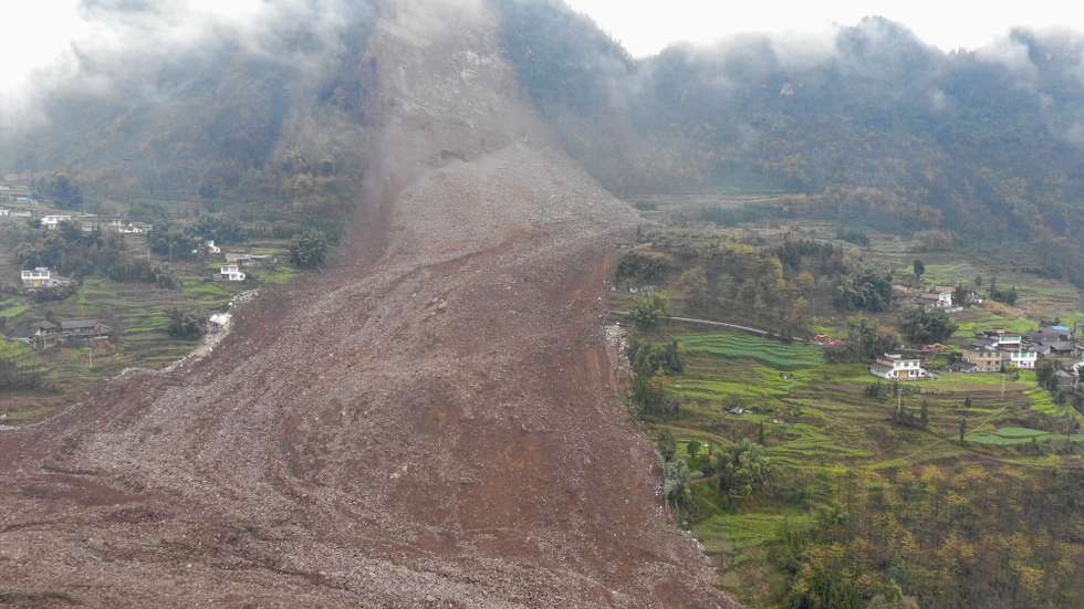 epa11882463 The site of a landslide in Jinping Village, Junlian County, in the city of Yibin, southwest China's Sichuan Province, 08 February 2025. Southwest China's Sichuan Province upgraded its geological disaster emergency response after a landslide buried 10 houses and left over 30 people missing. Two people were rescued in the afternoon, and rescue efforts are ongoing.  EPA/XINHUA / Jiang Hongjing CHINA OUT / UK AND IRELAND OUT  /       MANDATORY CREDIT EDITORIAL USE ONLY
