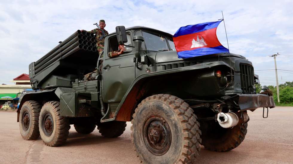 epa12259908 Cambodian soldiers ride on a self-propelled multiple rocket launcher in Oddar Meanchey province, Cambodia, 25 July 2025. Cambodian troops took position near the front line during fighting with Thai forces over a disputed border zone.  EPA/KITH SEREY