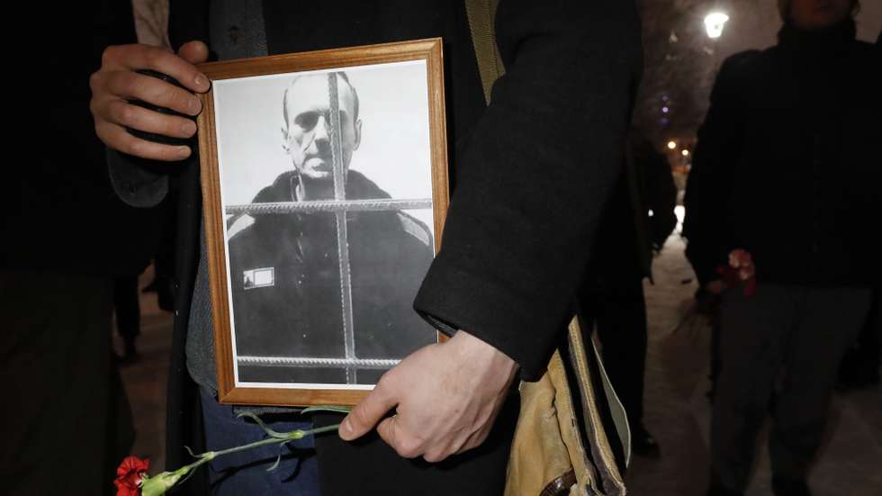 epa11159155 People lay flowers and light candles next to the photo of Russian late opposition leader Alexey Navalny during a vigil following his death, near the memorial to political prisoners in St. Petersburg, Russia, 16 February 2024. Russian opposition leader and outspoken Kremlin critic Alexey Navalny has died aged 47 in a penal colony, the Federal Penitentiary Service of the Yamalo-Nenets Autonomous District announced on 16 February 2024. A prison service statement said that Navalny 'felt unwell' after a walk on 16 February, and it was investigating the causes of his death. Late last year, he was transferred to an Arctic penal colony considered one of the harshest prisons.  EPA/ANATOLY MALTSEV