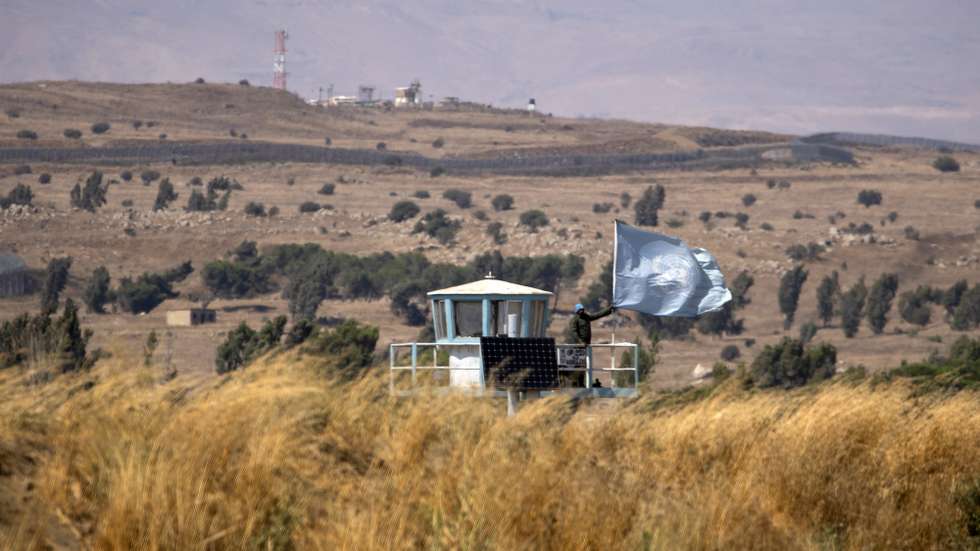 epa08675026 UNDOF (United Nations Disengagement  Observer force) soldiers monitor from an observation tower on the Israeli-Syrian border next to Quneitra, in the Golan Heights, 11 August 2020 (issued 17 September 2020). The United Nations in the year 2020 mark the 75th anniversary, and some peacekeeping missions remain in the region as a reflection of the presence of UN in the Middle East, according to the UN. The United Nations Disengagement Observer Force (UNDOF) was established by the Security Council on 1974, the mandate is to maintain the ceasefire between the parties and supervise the disengagement of Israeli and Syrian forces as well as the so-called areas of separation (a demilitarized buffer zone) and limitation (where Israeli and Syrian troops and equipment are restricted) in the Golan Heights.  EPA/ATEF SAFADI
