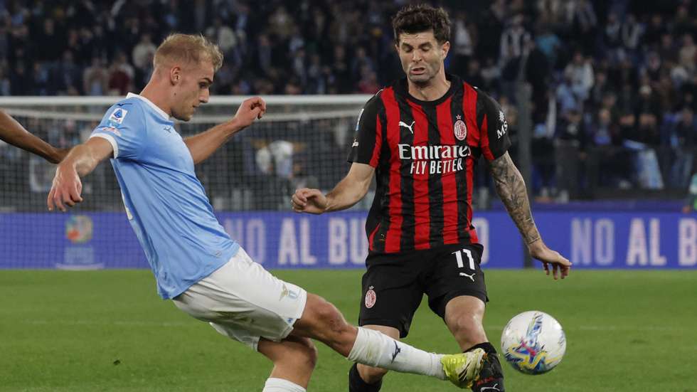 epa12822788 Lazio’s Gustav Tang Isaksen (L) and Milan’s Christian Pulisic in action during the Italian Serie A soccer match between SS Lazio and AC Milan, in Rome, Italy, 15 March 2026.  EPA/GIUSEPPE LAMI
