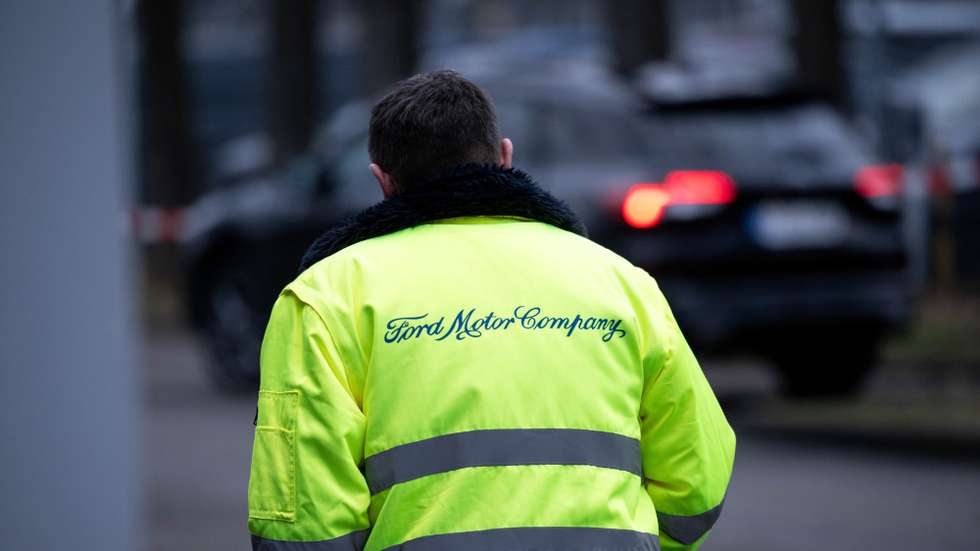 epa11767830 An employee wearing a jacket with the company name 'Ford Motor Company' walks at the Ford plant in Cologne, Germany, 09 December 2024.​ Workers held a protest at the employee meeting in Cologne, Germany, 10 December 2024, prior to the visit of German Chancellor Olaf Scholz. In November 2024, Ford announced that it would cut around 4,000 jobs in Europe by 2027, citing the significant losses of recent years as the reason.  EPA/FABIAN STRAUCH