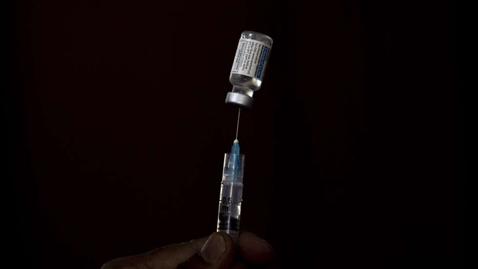 epa09354457 A health worker prepares a dose of Johnson and Johnson vaccine against COVID-19 for foreign employment workers at a vaccination center in Kathmandu, Nepal, 20 July 2021. Nepal started its vaccination rollout for foreign employment workers after the USA, through the COVAX initiative, supplied the country on 12 July 2021, with 1.5 million doses of the Johnson and Johnson's Janssen COVID-19 vaccine. More than 400,000 Nepalese youths leave the country each year, mainly to gulf countries, due to the lack of proper job opportunities in their home country.  EPA/NARENDRA SHRESTHA