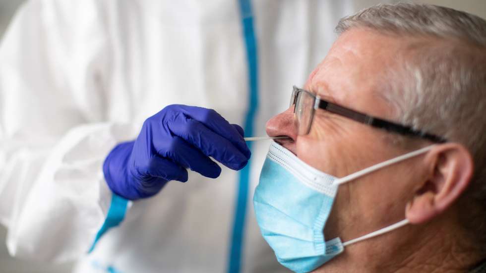 epa08839155 A health worker takes a swab sample for an antigen covid-19 test at a health center in Badalona, Barcelona, Spain, 24 November 2020. According to authorities, the number of coronavirus cases in Catalunia continue to drop, although measures are still being carried out to avoid new cases.  EPA/MARTA PEREZ