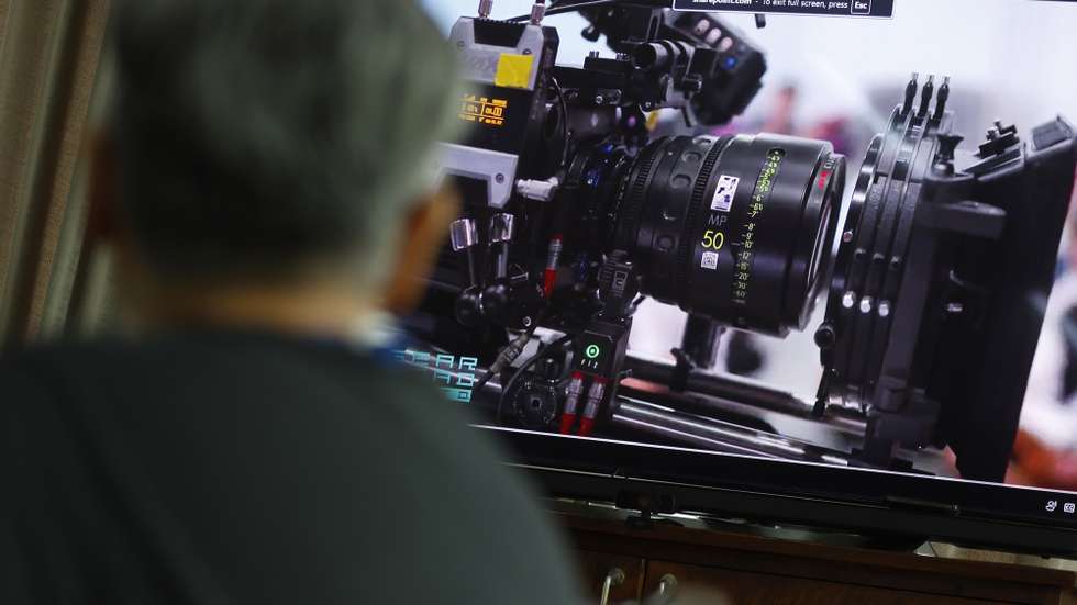 epa12240356 Chayanont Ulit, the senior deputy managing director of the film equipment rental company Gear Head, looks at a picture of a cinema camera during an interview at the office of The Studio Park, the country's largest film studio, in Samut Prakan province, Thailand, 09 July 2025 (issued 16 July 2025). Thailand unveiled the country's largest film studio, The Studio Park, a world-class film production facility offering the most advanced virtual production in Southeast Asia. The facility aims to attract international and domestic filmmakers to drive Thailand to become a prominent destination for international filming hubs as part of the Thai government's plan to strengthen creative industry particularly film production. Thailand's film industry showed significant growth in 2024 after attracting 491 international film productions in Thailand, including the third season of White Lotus and the US hollywood movie Jurassic Park, generating over 6.58 billion baht (194 million US dollar), according to a report released by the Thailand Film Office.  EPA/NARONG SANGNAK