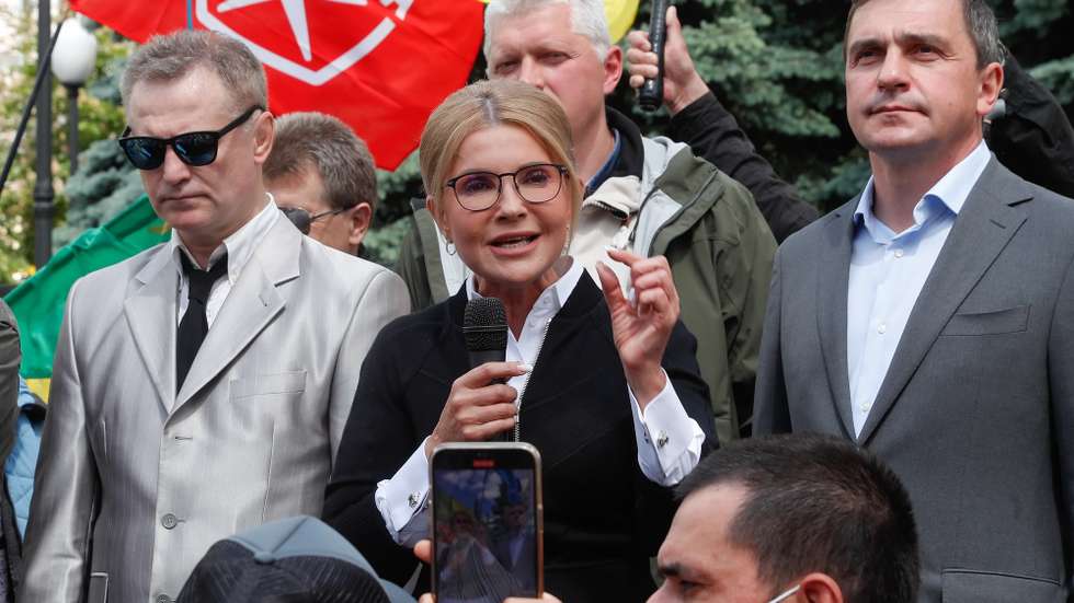 epaselect epa09244649 Ukrainian politician and lawmaker Yulia Tymoshenko speaks to protestors during a rally against the country's opening of the land sale market, in front of the Constitution court building in Kiev, Ukraine, 03 June 2021. The Constitutional Court of Ukraine on 03 June 2021 started considering a motion filed by a group of Ukrainian lawmakers challenging the law on farmland turnover. The law foresees from July 1, 2021, citizens of Ukraine will be able to buy farmland plots capped at 100 hectares. Starting from January 1, 2024, the cap will be raised to 10000 hectares, while legal entities will also be allowed to acquire land plots.  EPA/SERGEY DOLZHENKO