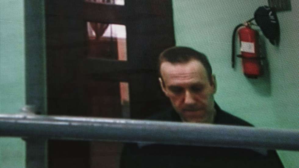 epa10705295 Russian opposition figure Alexei Navalny is seen on a screen via a video link from his penal colony during a hearing about his right to correspond while in jail, at the Russian Supreme court in Moscow, Russia, 22 June 2023.  The Supreme Court of the Russian Federation recognized as lawful the internal regulations of correctional institutions on the issuance of writing materials to persons held in punishment cells. Navalny has been in the colony since February 2021, when the court, at the request of the Federal Penitentiary Service, replaced his suspended sentence in the Yves Rocher case of 2014 with a real one. He was supposed to serve in a penal colony for 2 years and 8 months, but in March 2022, the Lefortovo Court of Moscow, at an off-site meeting in correctional colony-2 in the city of Pokrov, Vladimir Region, sentenced the politician to 9 years of strict regime and a fine of 1.2 million rub., as well as one and a half years of restriction of freedom in the case of fraud and contempt of court. In June 2022, the sentence entered into force.  EPA/SERGEI ILNITSKY