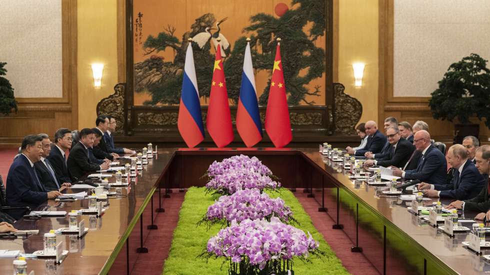 epa12344838 Russian President Vladimir Putin (2-R) speaks at the start of a bilateral meeting with Chinese President Xi Jinping (L) at the Great Hall of the People in Beijing, China, 02 September 2025.  EPA/POOL