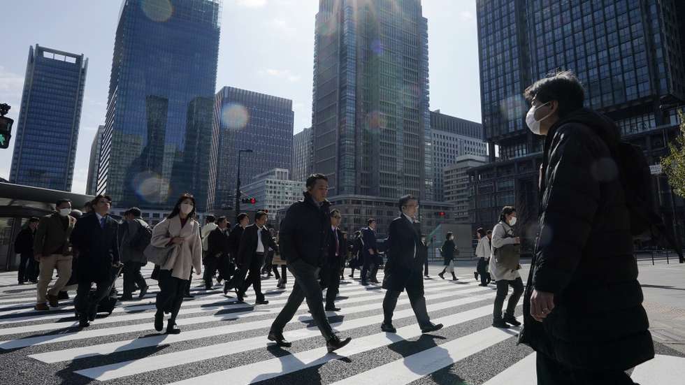epa11203702 People walk a crosswalk in Tokyo, Japan, 07 March 2024. Japan's Ministry of Health, Labor and Welfare released data on 07 March 2024, showed the real wages in January decreased 0.6 percent from previous year, marking the 22nd straight month of decline.  EPA/KIMIMASA MAYAMA