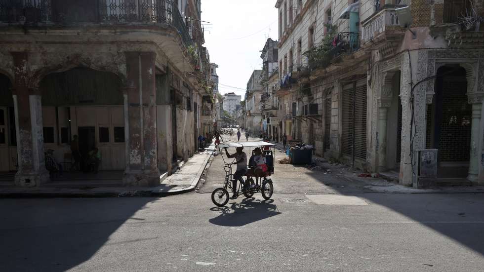 epa13083800 People are riding in a bicycle taxi in Havana, Cuba, 02 July 2026 (issued 03 July 2026). Six months of a US 'maximum pressure' campaign have left Cuba facing a surge in power outages. The policy uses a strict oil embargo, economic sanctions, and implicit threats of military intervention to isolate the island nation.  EPA/Ernesto Mastrascusa