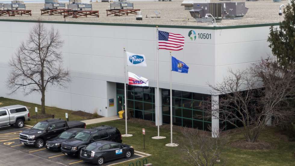epa08855298 An aerial photo made with a drone shows a Pfizer facility in Pleasant Prairie, Wisconsin, USA, 01 December 2020. According to reports Pfizer is using cold storage at its distribution site in Pleasant Plains to hold the Covid-19 vaccine while awaiting approval from the Federal Drug Administration of a Emergency Use Authorization request. The FDA is scheduled to take up the request 10 December 2020. A federal advisory group is to make recommendations 01 December on the order of distribution with health care workers and long term care facilities resident expected to be the first to receive the vaccine once it is approved.  EPA/TANNEN MAURY
