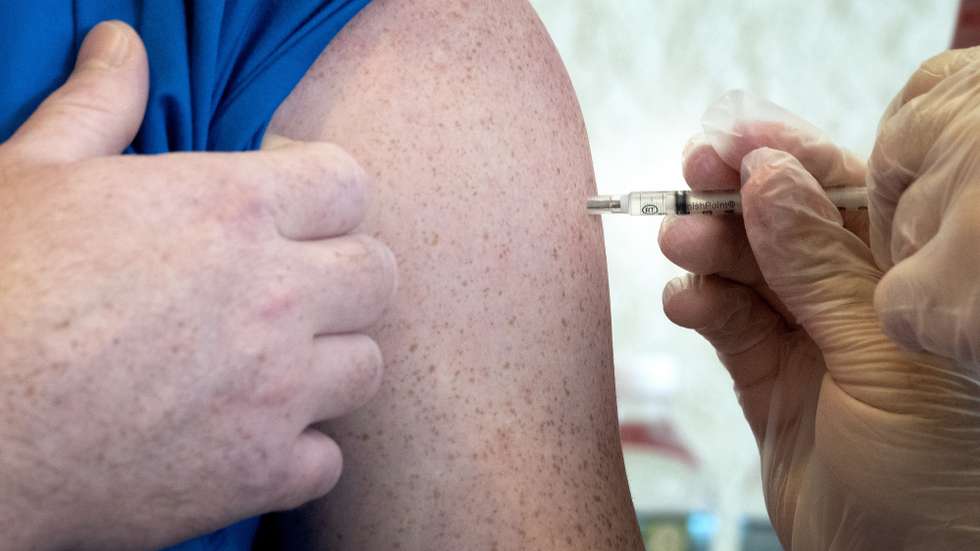 epa08933284 A patient receives an injection of the Pfizer-BioNTech COVID-19 Vaccine at the Palace Coral Gables Senior Living Communities in Coral Gables, Florida, USA, 12 January 2021. At this location only the staff and residents senior citizens 65 years old and older will receive the vaccine.  EPA/CRISTOBAL HERRERA-ULASHKEVICH