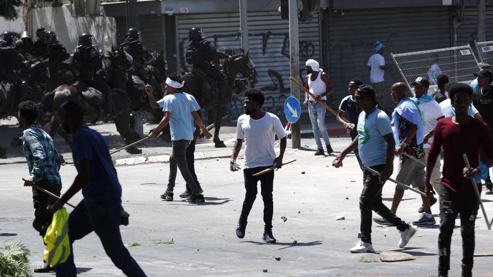 epa10835539 Opponents of the Eritrean regime move in a  street during a protest against a pro-regime conference followed by clashes with Israeli police, in Tel Aviv, Israel, 02 September 2023. The protest was againt a pro-Eritrean regime conference due to be held at the Eritrean embassy in Israel on 02 September. The confrence is part of many others organized by Eritrean embassies worldwide with violent reactions to it a few times as well. According to Israeli medical sources, some 35 protesters and 12 policemen were injured in the clashes.  EPA/ATEF SAFADI