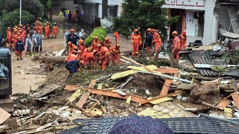 epa11502293 A handout photo made available by the Fire and Rescue Department of Hunan shows rescuers working at a landslide-hit area in Yuelin village of Shouyue Town in Hengyang City, central China, 28 July 2024. The death toll resulting from a rain-triggered landslide in central China's Hunan Province has risen to 11, the provincial emergency command center said on 28 July. The landslide, which hit Yuelin village at approximately early 28 July, washed away part of a residential house, causing 18 people to be buried, the command center reported.  EPA/Fire and Rescue Department of Hunan handout via Xinhua HANDOUT CHINA OUT / UK AND IRELAND OUT  /       MANDATORY CREDIT  HANDOUT EDITORIAL USE ONLY/NO SALES