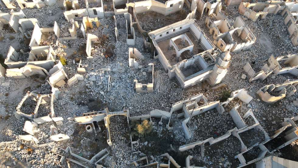 epa11811628 An aerial photograph taken with a drone shows damaged buildings at Al Shamiya village in Damascus, Syria, 07 January 2025, after opposition forces toppled president Bashar al-Assad. The village, which was built as a set for the production of a popular Syrian television series featuring houses, cafes, theaters, and museums, was damaged during the Syrian civil war that began in 2011. Productions at the site included Bab Al-Hara (The Neighbourhood's Gate), a popular television series in the Arab world.  EPA/MOHAMMED AL RIFAI