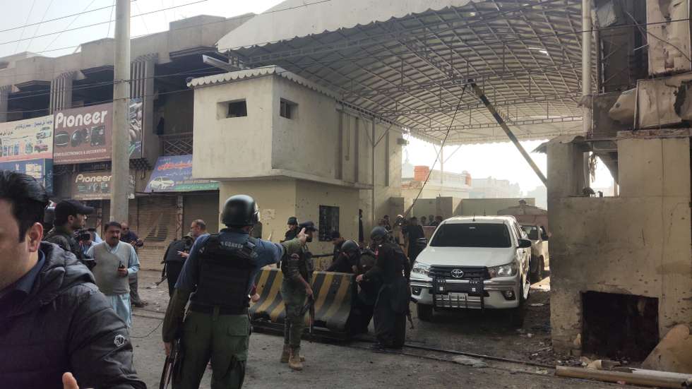 epa12545092 Pakistani security officials inspect the scene of a militant attack at the paramilitary FC headquarters in Peshawar, the provincial capital of KPK, Pakistan, 24 November 2025. At least three FC soldiers and three militants were killed.  EPA/BILAWAL ARBAB