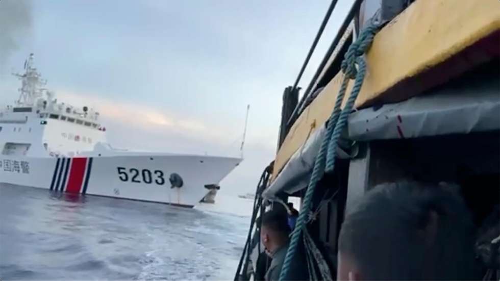 epa10932372 A handout frame grab photo from a video made available by the Philippine’s Armed Forces shows a Chinese coast guard ship with bow number 5203 after bumping a Philippine’s Armed Forces supply boat as they approach Second Thomas Shoal, locally called Ayungin Shoal, at the disputed South China Sea on 22 October 2023. In a statement issued by the National Task Force for the West Philippine Sea (NTF-WPS), a China Coast Guard (CCG) vessel collided with Armed Forces of the Philippines contracted resupply boat as they approach Second Thomas Shoal at the disputed South China Sea. China and the Philippines are engaged in a territorial dispute over the sovereignty of several islands and atolls in the South China Sea.  EPA/PHILIPPINE'S ARMED FORCES / HANDOUT BEST QUALITY AVAILABLE HANDOUT EDITORIAL USE ONLY/NO SALES HANDOUT EDITORIAL USE ONLY/NO SALES