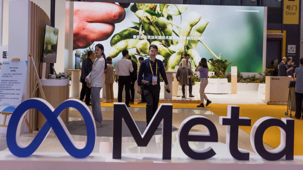epa10958954 A man walks at the Meta company booth at the China International Import Expo in Shanghai, China, 05 November 2023. The China International Import Expo (CIIE) in Shanghai runs from 05 to 10 November 2023.  EPA/ALEX PLAVEVSKI
