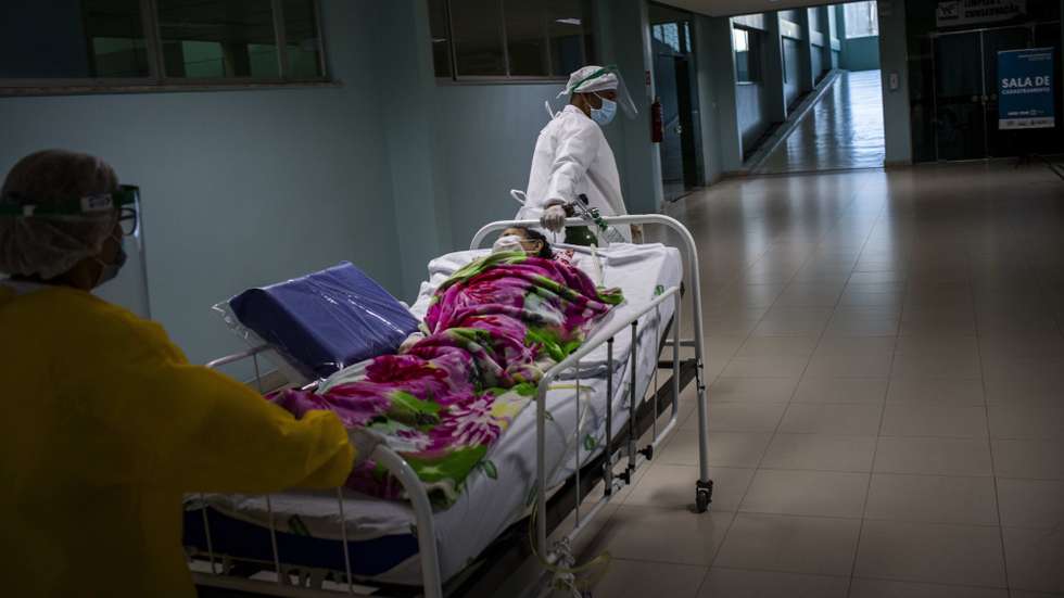 epa08461457 An indigenous patient of COVID-19 receives treatment at the medical care unit for indigenous people infected by COVID-19, in Manaus, Brazil, 02 June 2020. The Brazilian state of Amazonas, one of the hardest hit by the pandemic in Brazil, has a medical care unit for indigenous people infected by COVID-19.  EPA/RAPHAEL ALVES