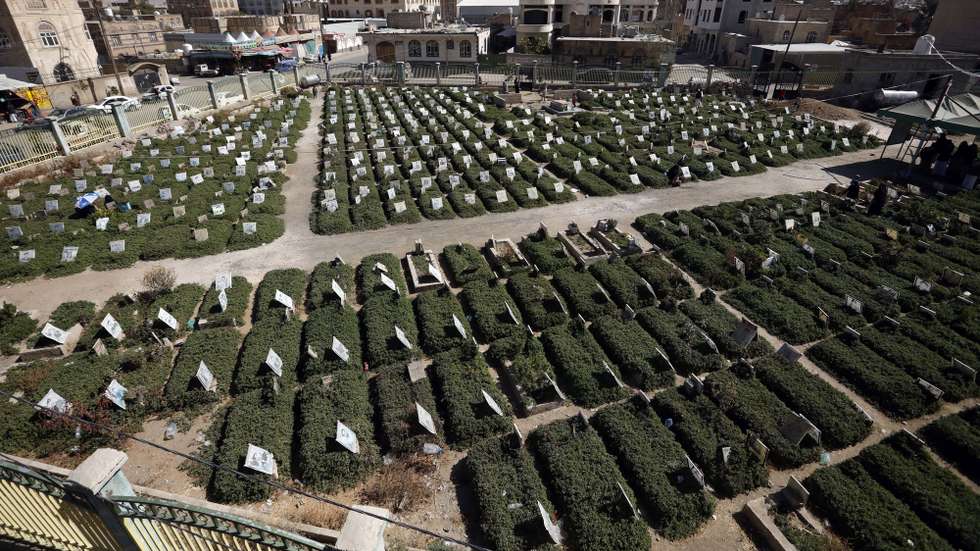 epa08862452 A view of portraits on the graves of people who were killed in Yemen's six-year-old war, at a cemetery in Sana'a, Yemen, 04 December 2020. According to UN recent estimates, over 233,000 people in war-torn Yemen have been killed over the last six years since a power struggle escalated in 2014 between the Houthis and the Saudi-backed Yemeni government, which sparked a full-blown fighting when the Saudi-led military coalition launched military operations and an airstrike campaign against the Houthis, seeking to restore Yemenâ€™s internationally-recognized government to power and push back the Houthis.  EPA/YAHYA ARHAB