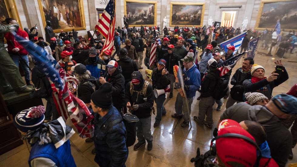 epaselect epa08923423 Supporters of US President Donald J. Trump in the Capitol Rotunda after breaching Capitol security in Washington, DC, USA, 06 January 2021. Protesters entered the US Capitol where the Electoral College vote certification for President-elect Joe Biden took place.  EPA/JIM LO SCALZO