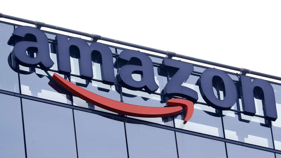 epa10390356 The Amazon logo is displayed on the exterior of an Amazon software development center (Amazon Web Services) in Bucharest, Romania, 05 January 2023. According to CEO Andy Jassy, Amazon is planning to lay off more than 18,000 employees as part of a workforce reduction.  EPA/ROBERT GHEMENT